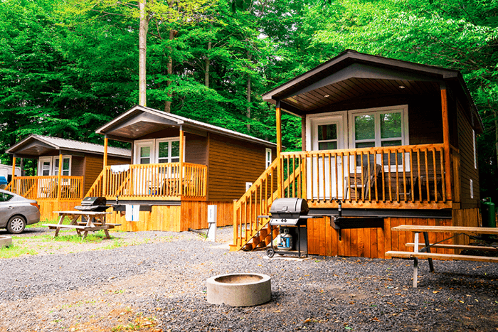 Cabins in Campground surrounded by green trees