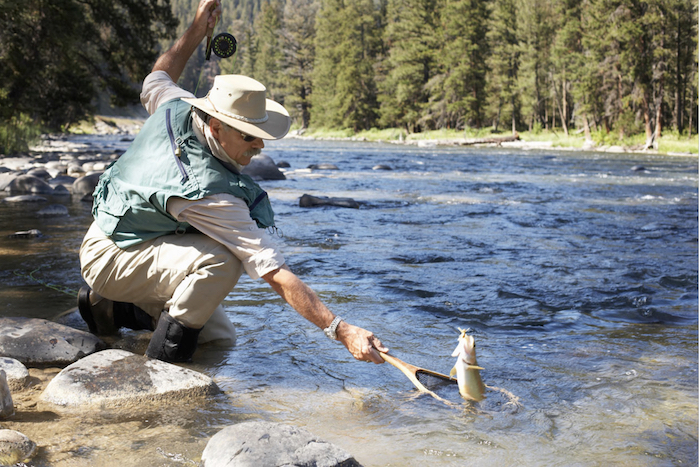 Man catching a fish in the river