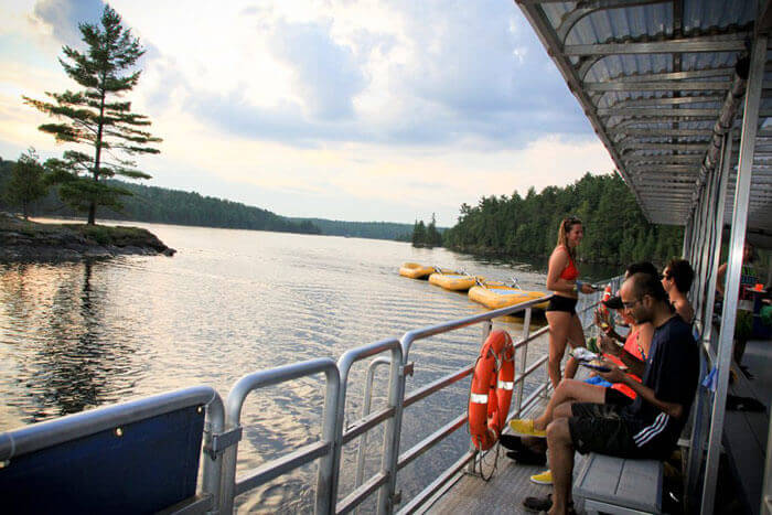 People relaxing on a pontoon on the Ottawa River