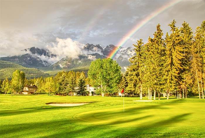 Rainbow over golf course at Fairmont Hot Springs Resort