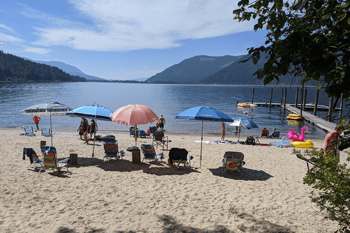 Beach umbrellas on sand at Mara Lake Resort