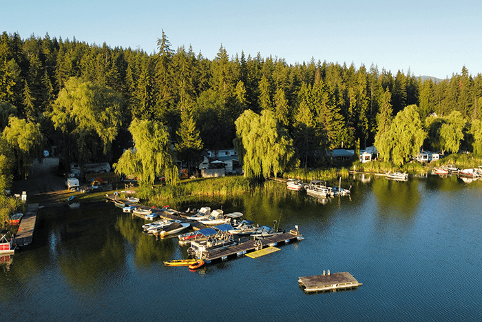 Boats docked at jetty at White Lake RV & Fishing Resort