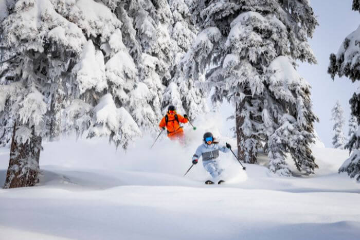 Couple skiing in deep snow