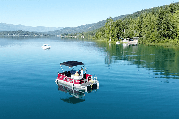 Red and White fishing pontoon on White Lake