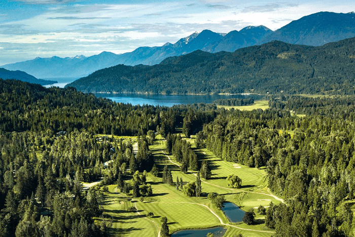 Golf Course amongst trees near a lake