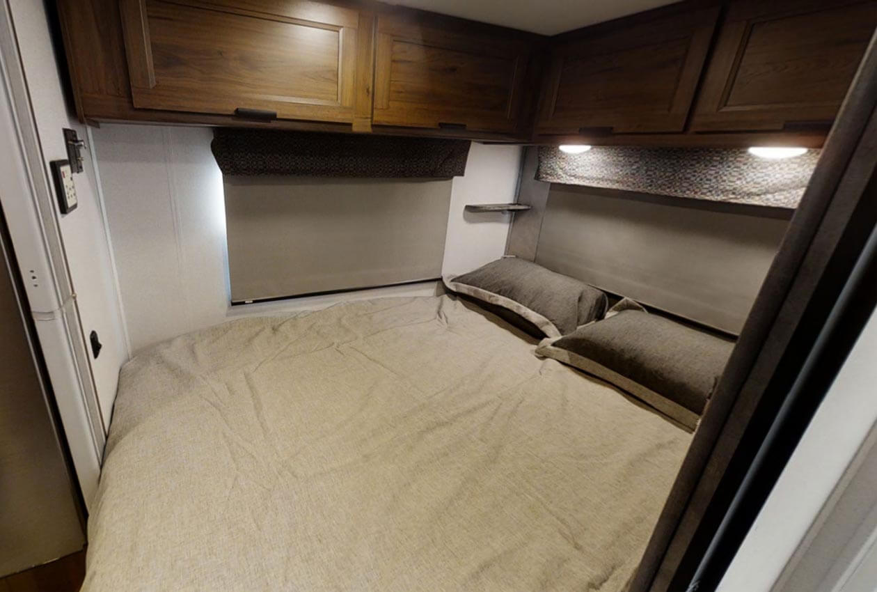 Rear queen bed in CanaDream RV Compact MHC Motorhome