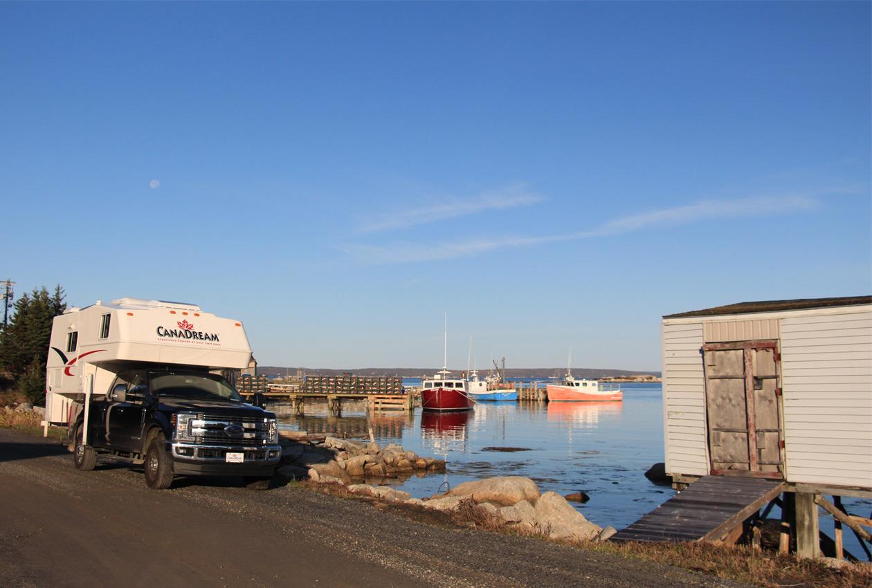 CanaDream truck and camper beside boats and water near Peggy's Cove Nova Scotia