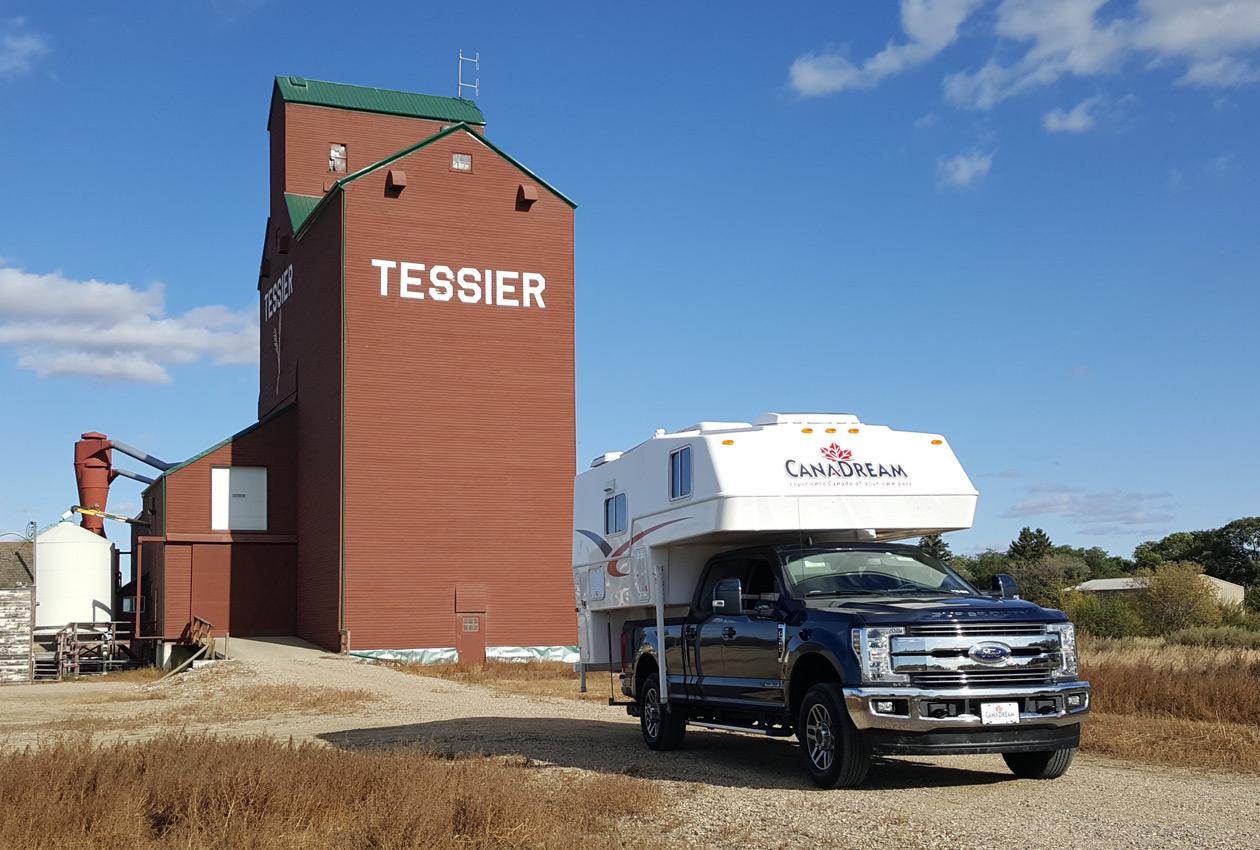 CanaDream truck and camper beside grain elevator in Tessier Saskatchewan