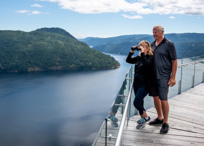 Couple looking out at scenery from Malahat Skywalk