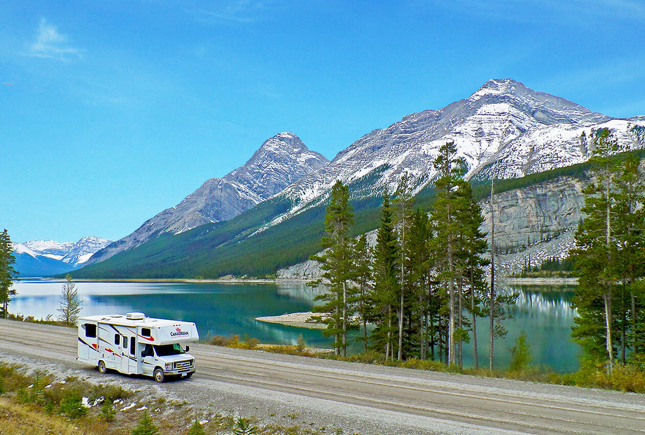 CanaDream Maxi Motorhome with lake and mountains in background Kananaskis
