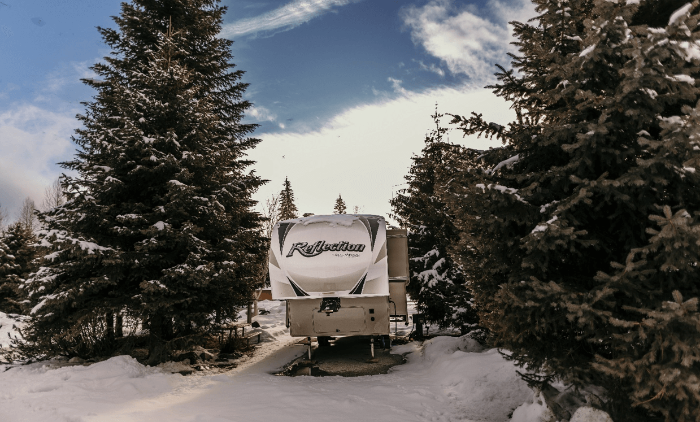 Camping amongst the trees in a Fifth Wheel Trailer